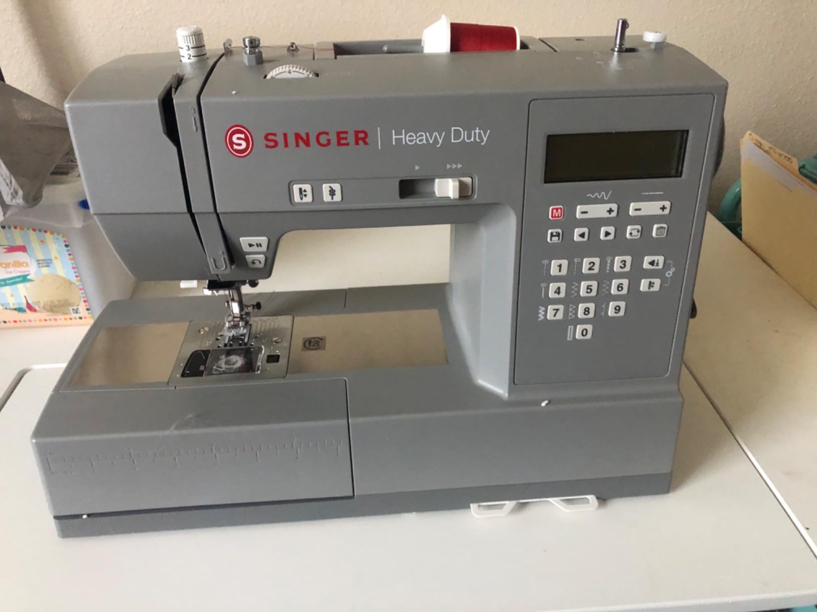 SINGER® 6700C Heavy Duty Computerized Machine with Accessory Kit | 411 stitch applications, lettering, touch button stitch selection, 1100 stitches/min,1-step buttonhole, LCD screen, LED light customer photo 1